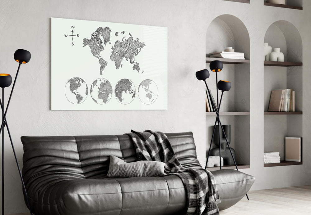 Continents glass wall art styled above a desk in a travel-mood study