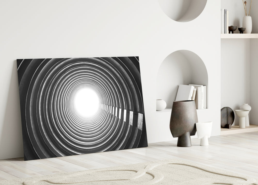 Close-up detail of concentric concrete ribs spiraling toward white light