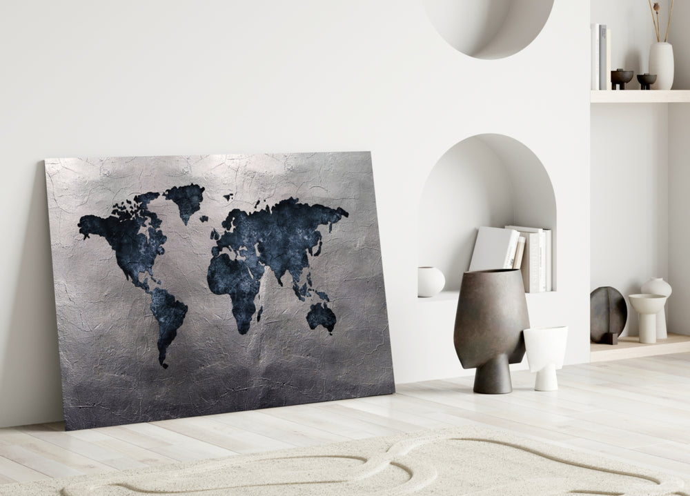 Close-up detail of navy continents on cracked silver-stone plaster