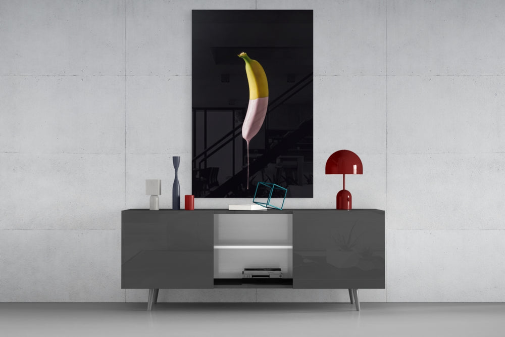 Banana panel catching gallery light to reveal its single dripping ribbon