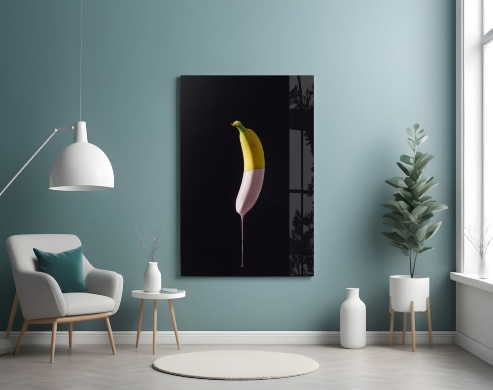 Banana glass wall art styled above a counter in a modern kitchen