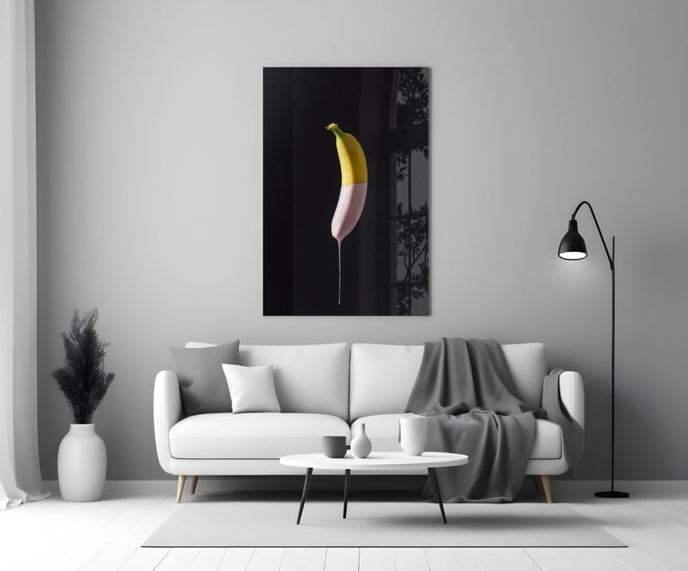 Close-up detail of yellow banana dipped in soft pink paint