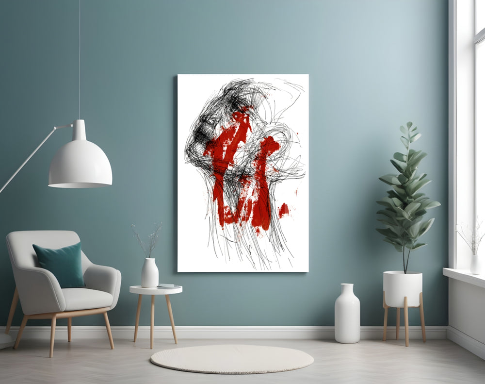 Red Thoughts glass wall art styled above a desk in an introspective study