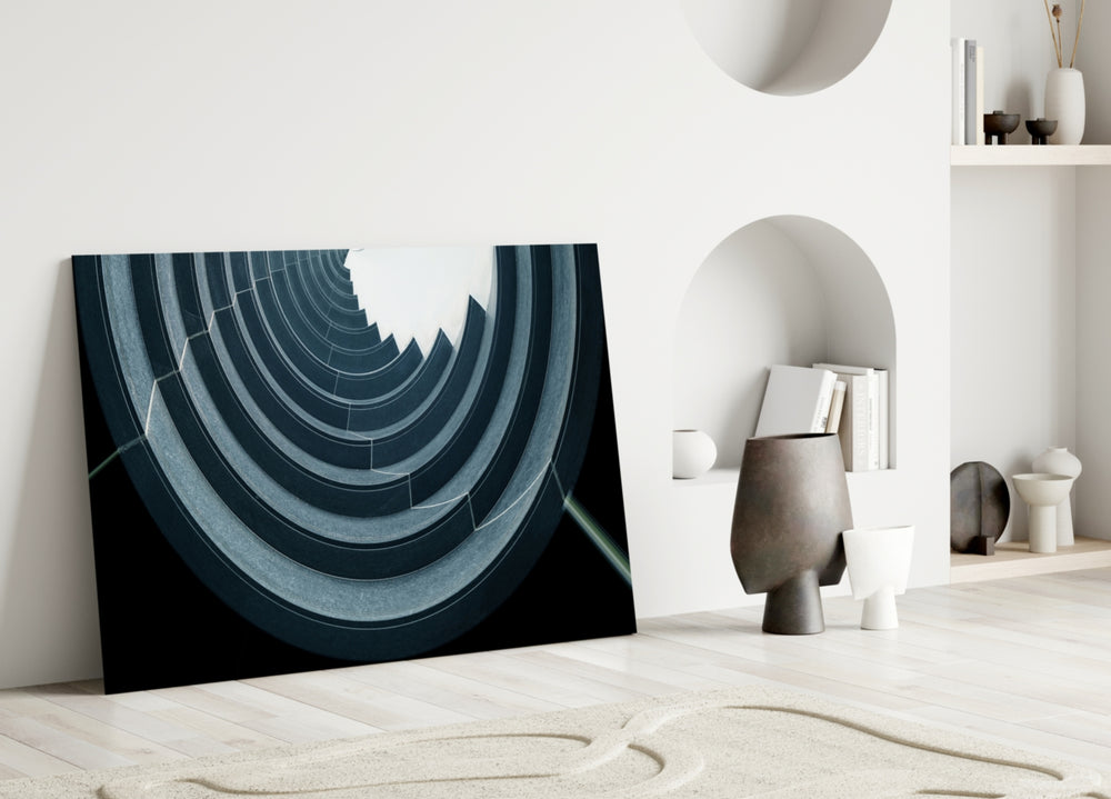 Close-up detail of concentric arcs curving toward a moon-like opening