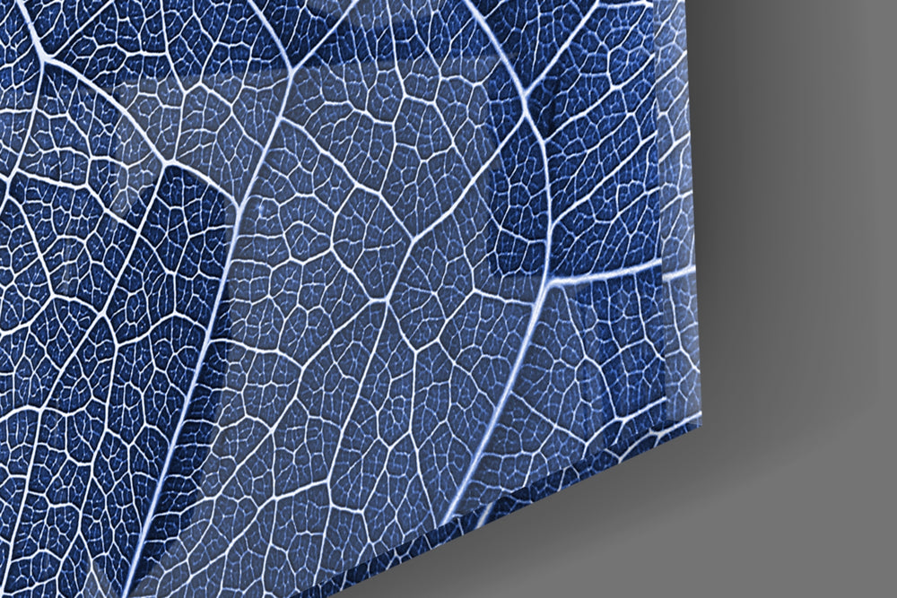 Macro Blue Leaf artwork anchoring a wall with cool biophilic palette