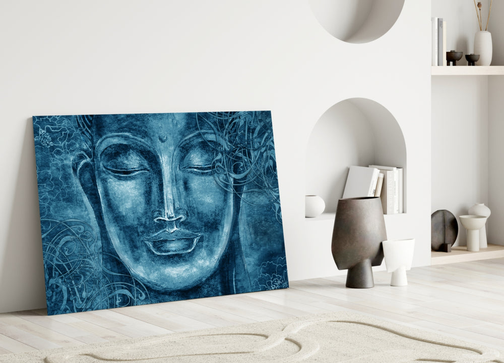 Close-up detail of cobalt Buddha face with floral filigree background