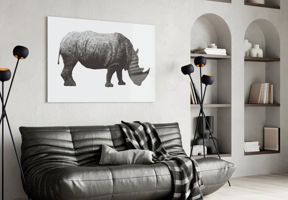 Rhino glass wall art styled above a desk in an editorial study