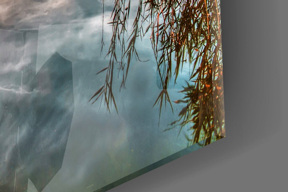Sunset artwork anchoring a wall with warm scenic palette