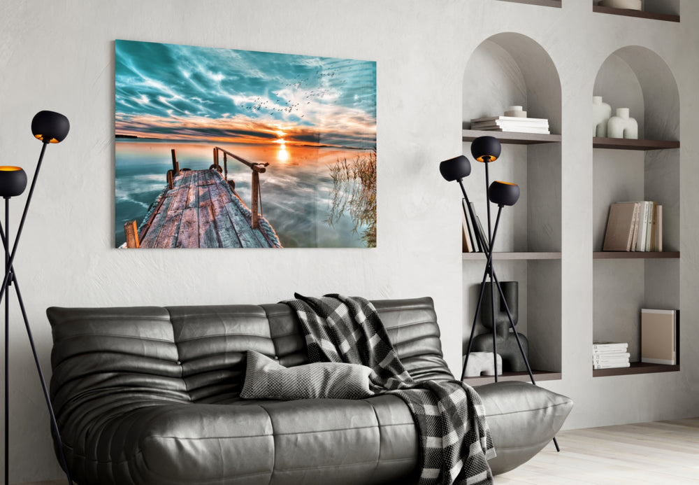 Sunset glass wall art styled above a desk in a traveler's-mood study