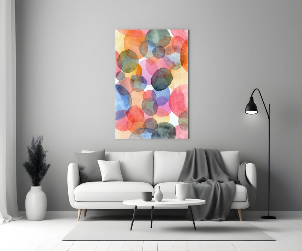 Close-up detail of overlapping pink, teal, and ochre watercolor circles