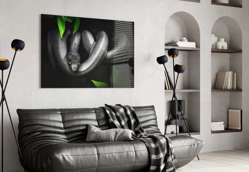 Snake glass wall art styled above a desk in an introspective study