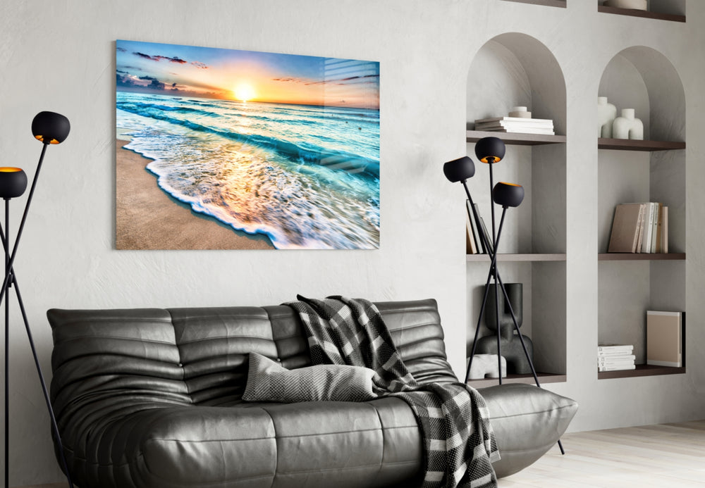 Sunset glass wall art styled above a console in a beach house