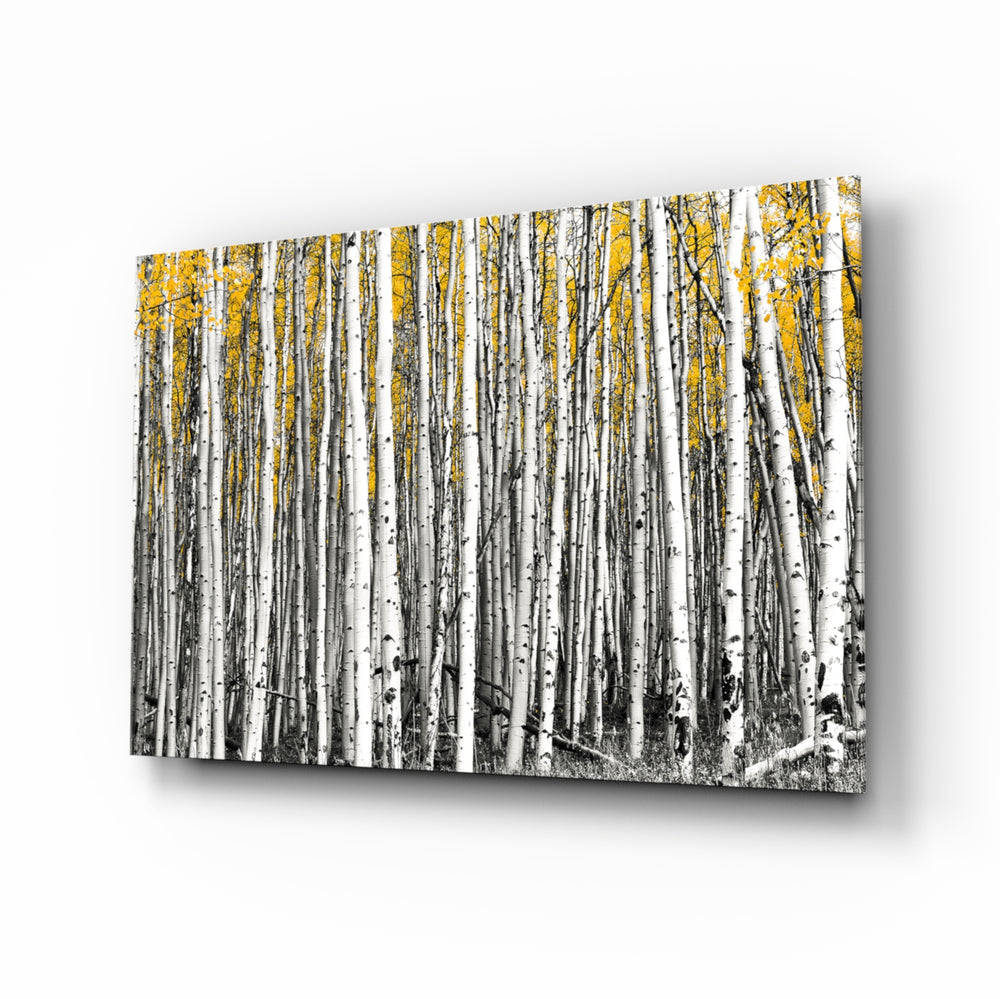 Yellow Forest glass wall art displayed above a console in a designer interior