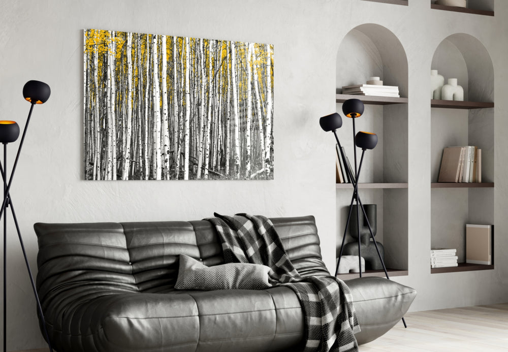 Yellow Forest glass wall art styled above a bed in a hygge bedroom