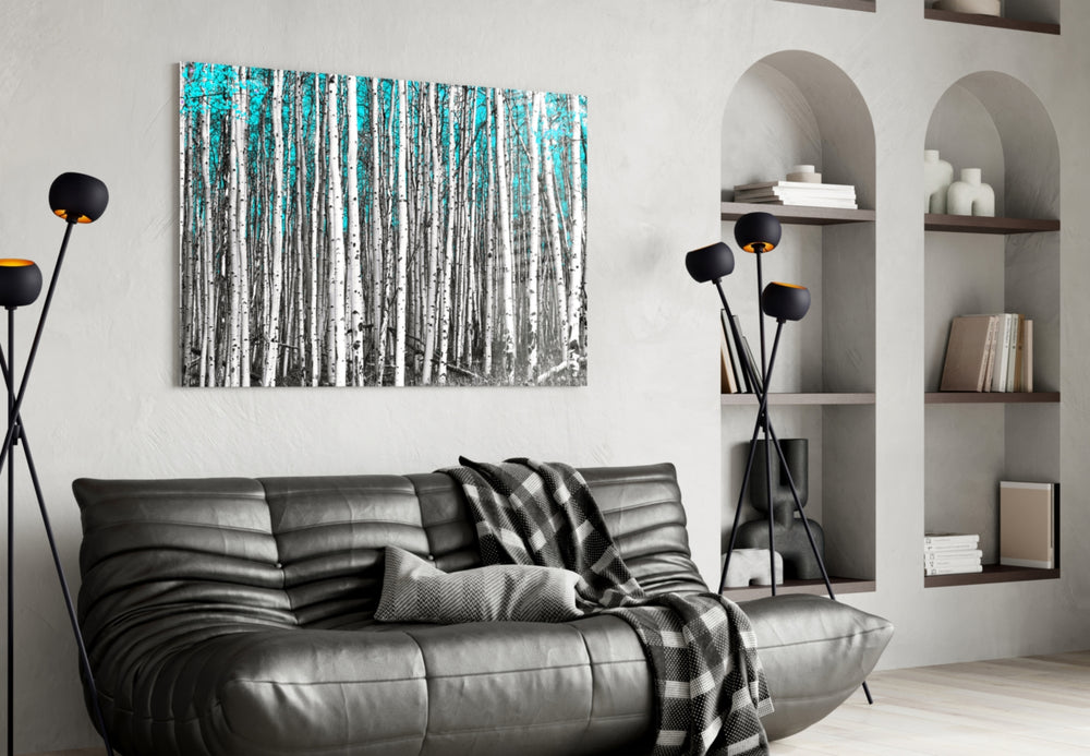 Blue Forest glass wall art styled above a bed in a serene bedroom
