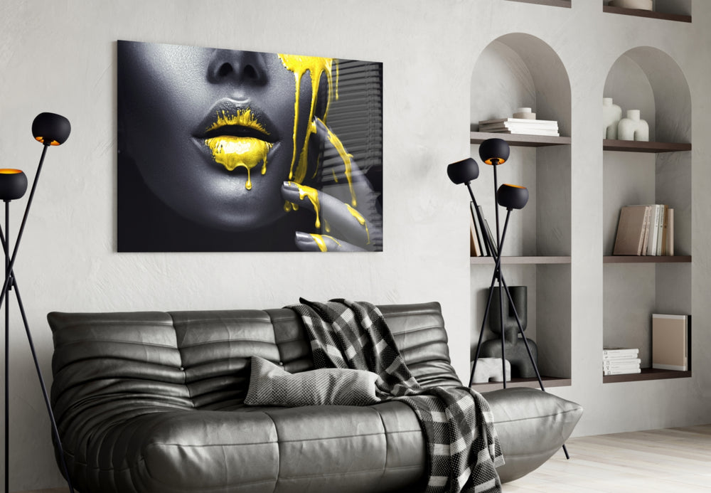 Yellow and Woman glass wall art styled above a vanity in a powder room