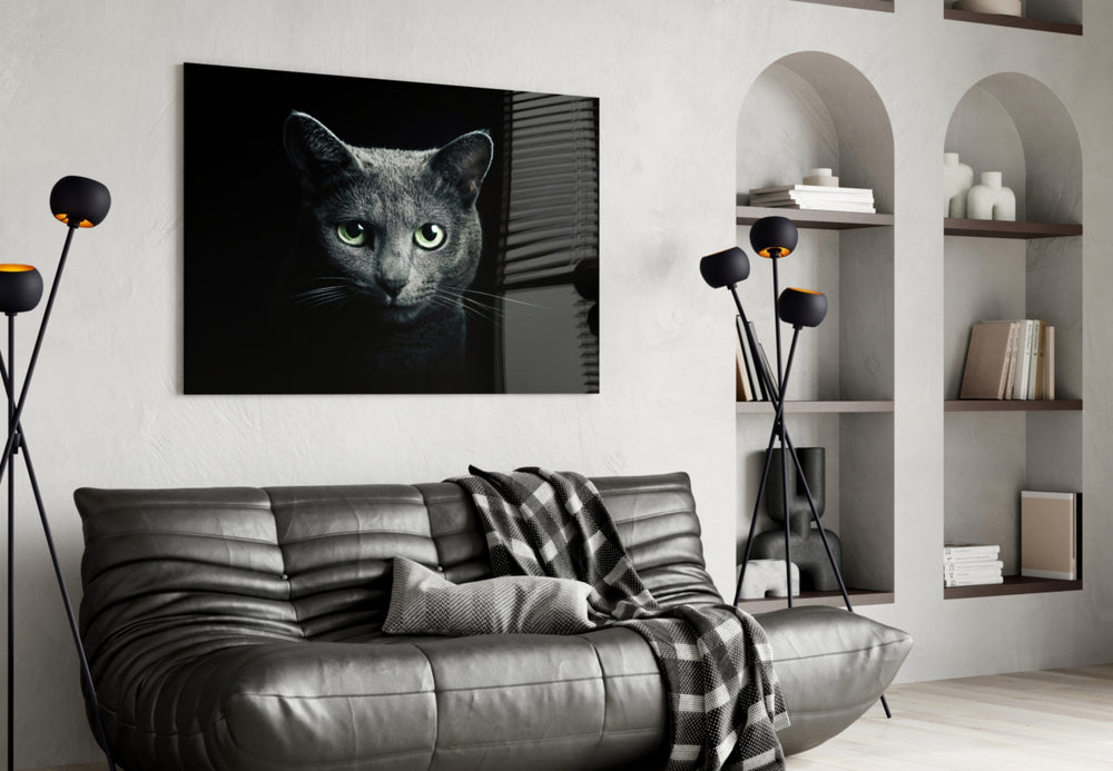 Cat glass wall art styled above a desk in an introspective study
