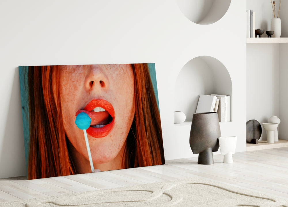 Close-up detail of scarlet lips and turquoise lollipop