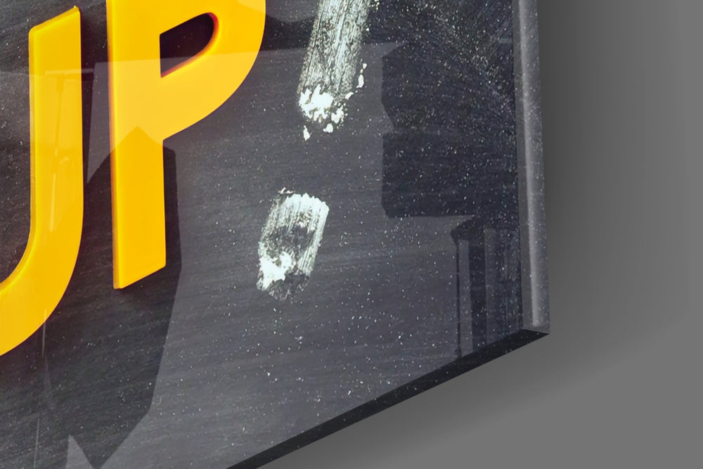 Don't Give Up artwork anchoring a wall with bold motivational palette
