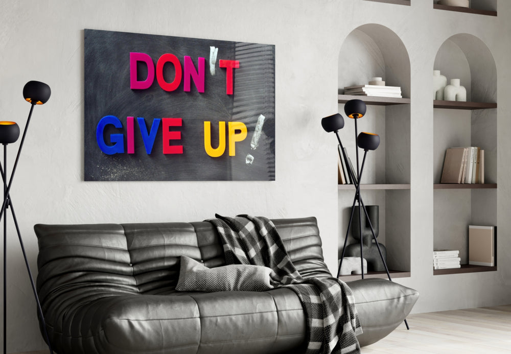 Don't Give Up glass wall art styled above a desk in a child's room