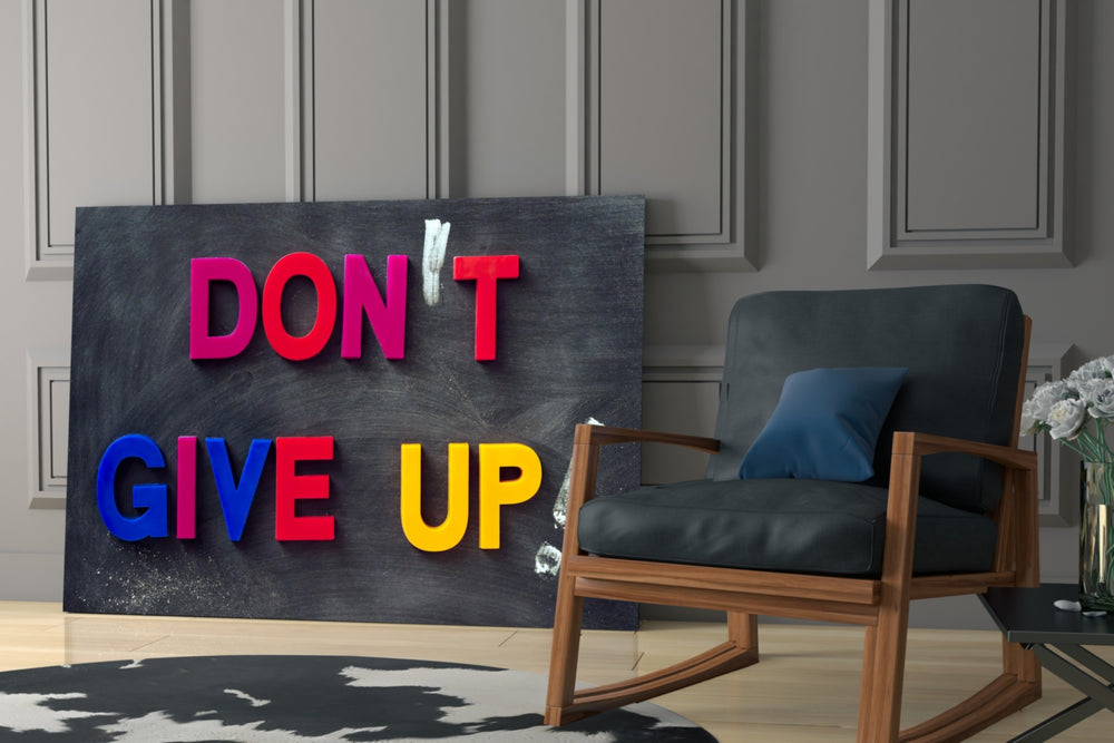 Don't Give Up glass print enhancing a teen room with statement spirit