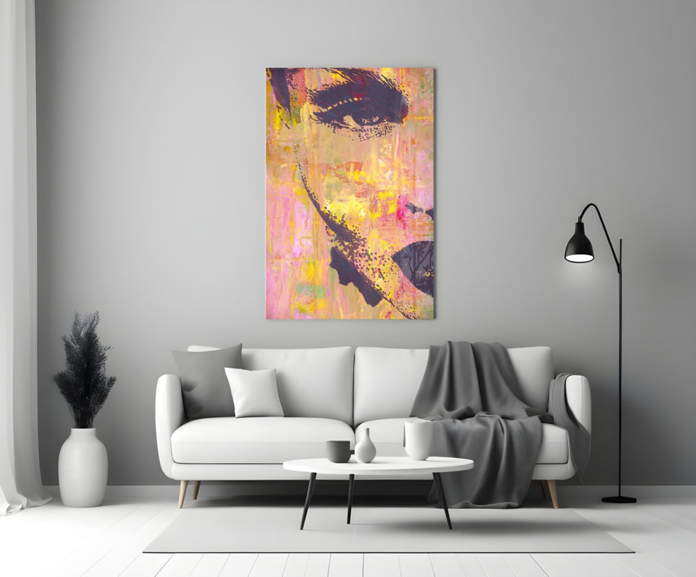 Close-up detail of dark stencil eyes on magenta-and-gold canvas