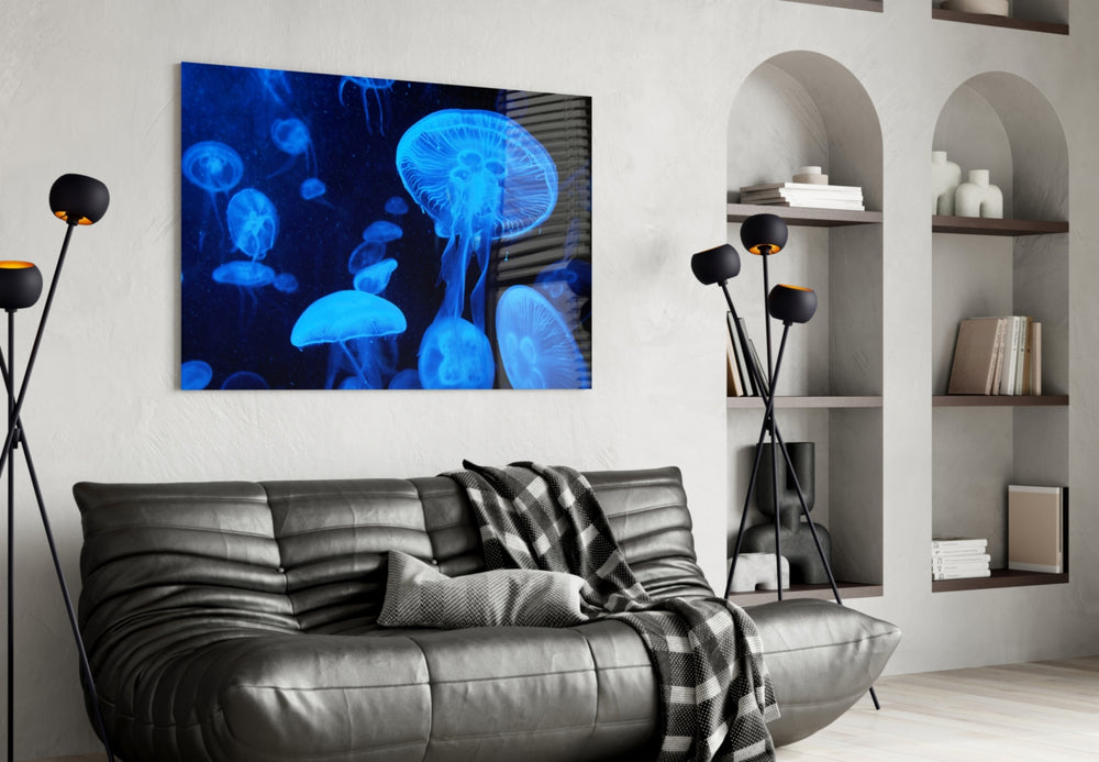 Jellyfish glass wall art styled above a bed in a serene bedroom