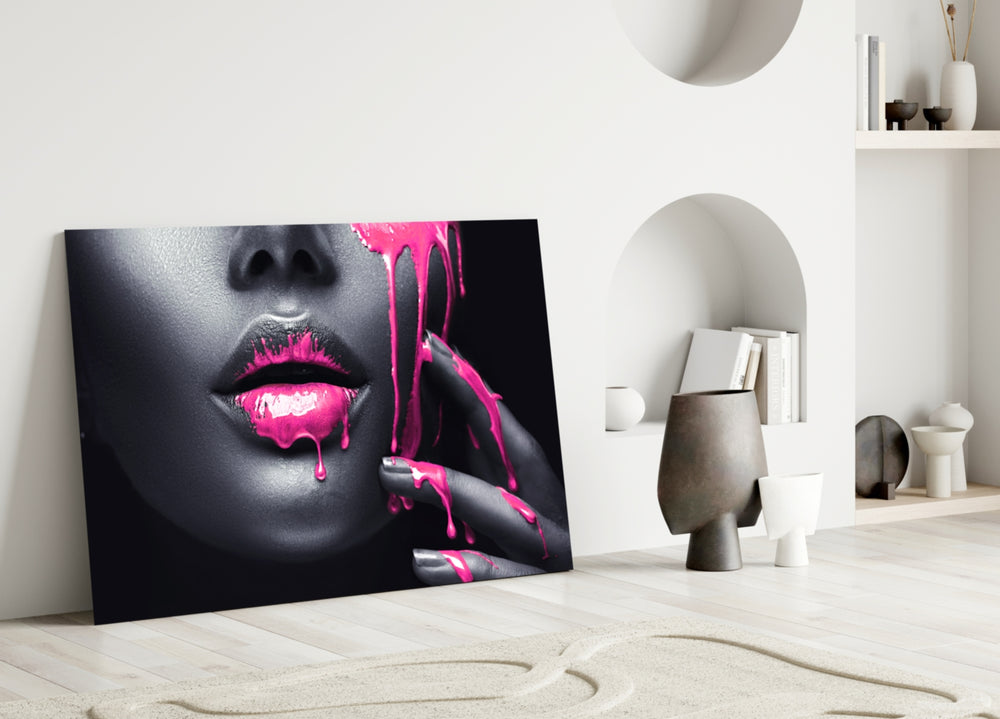Close-up detail of magenta paint streaming from charcoal lips