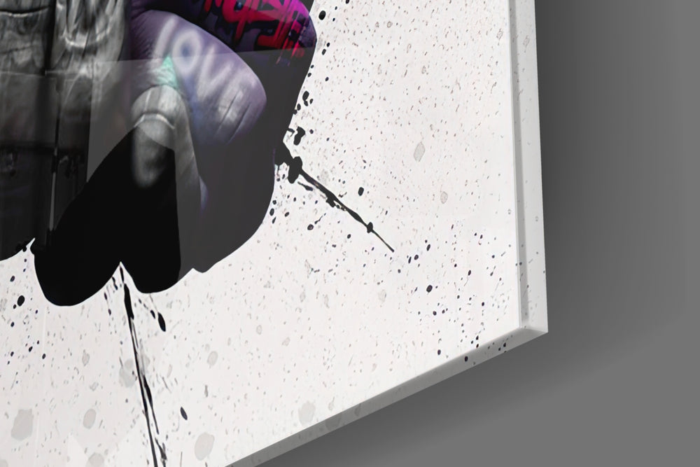 Hand in Hand artwork anchoring a wall with bold hopeful palette