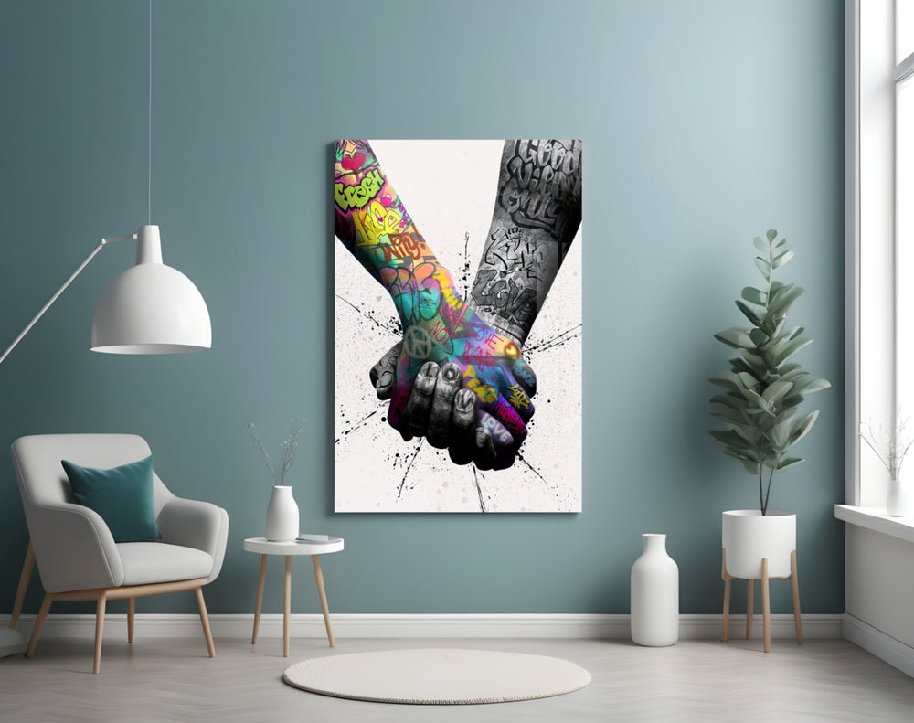 Hand in Hand glass wall art styled above a desk in a teen room