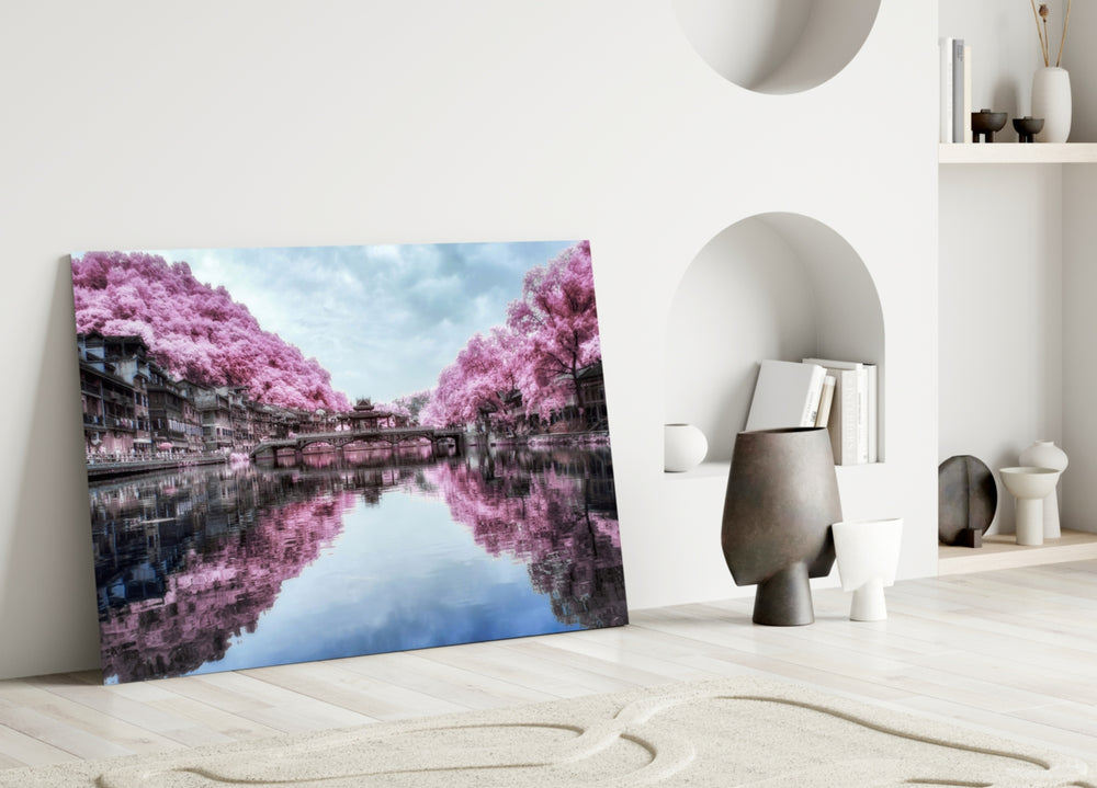 Close-up detail of cherry trees mirrored on still canal water
