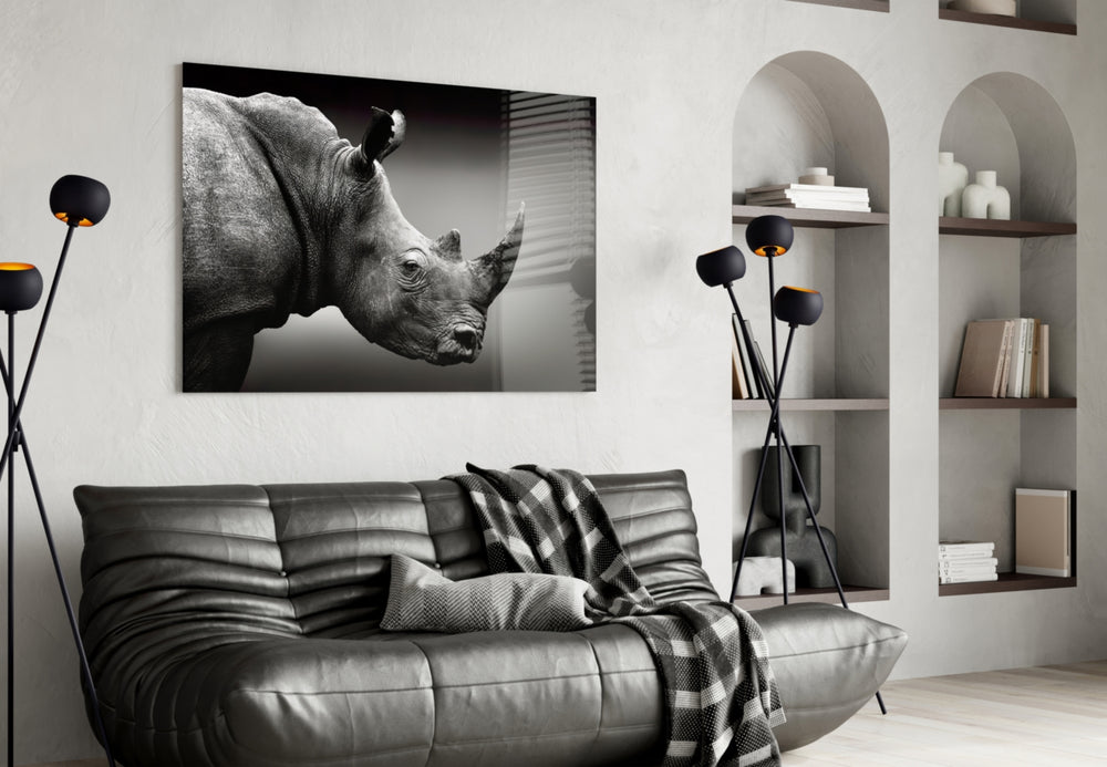 Rhino glass wall art styled above a desk in an introspective study