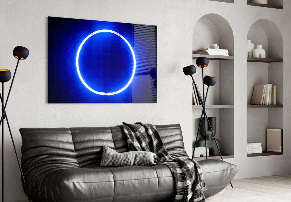 Blue Ring glass wall art styled above a desk in a creative office