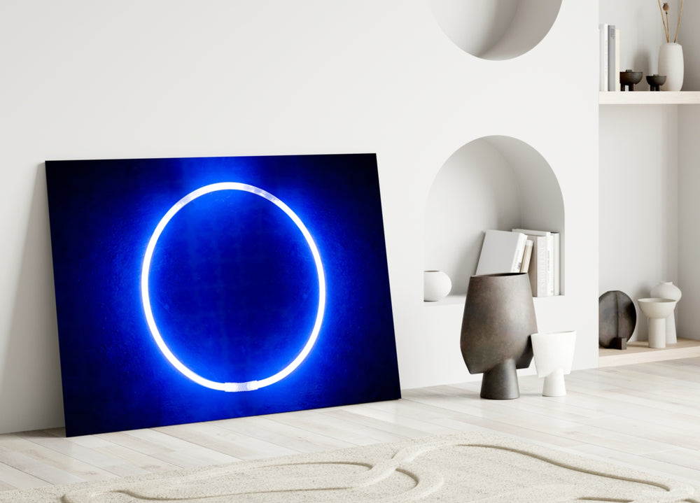 Close-up detail of luminous ring against cobalt textured wall