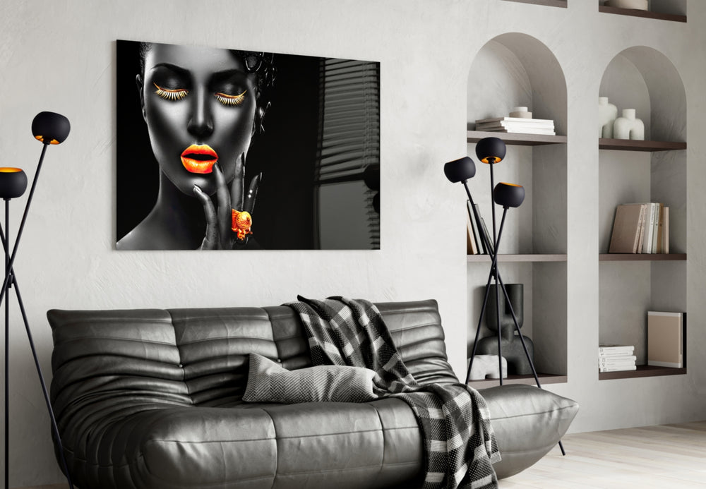The Power of Orange glass wall art styled above a vanity in a powder room