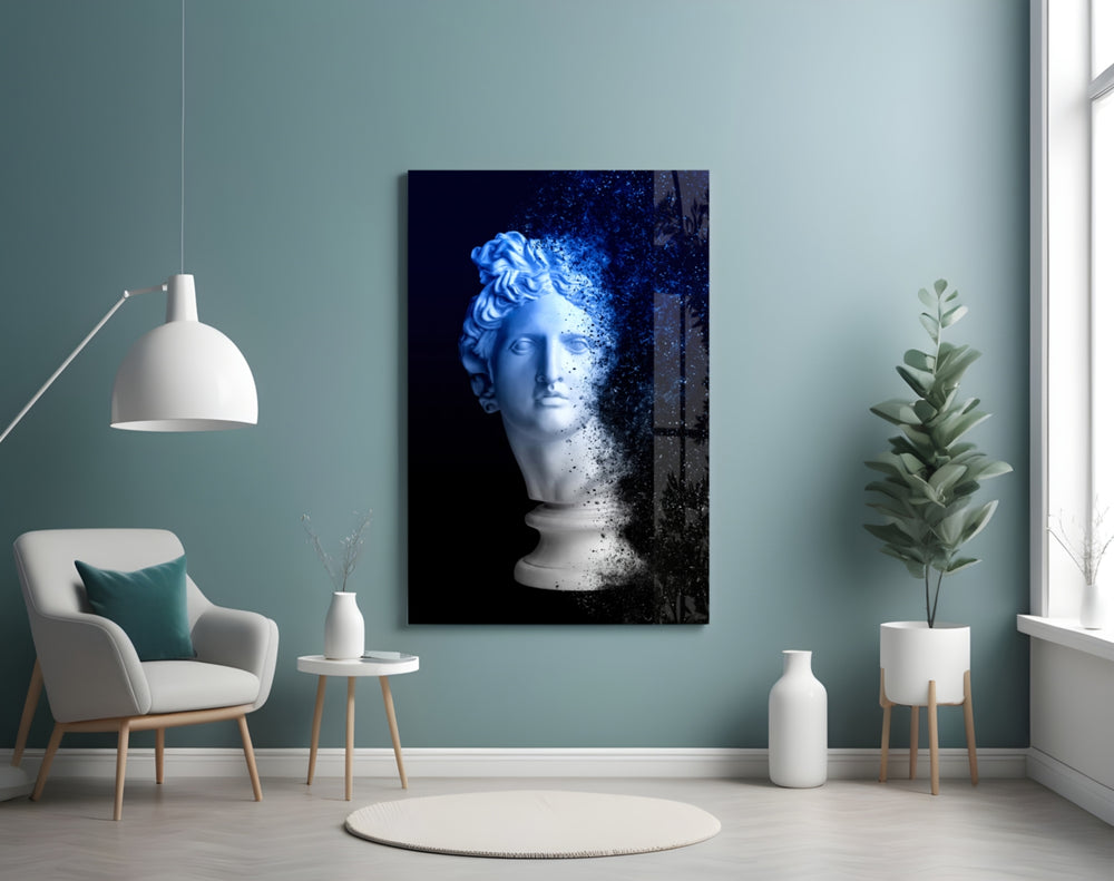 Sculpture glass wall art styled above a desk in an introspective study