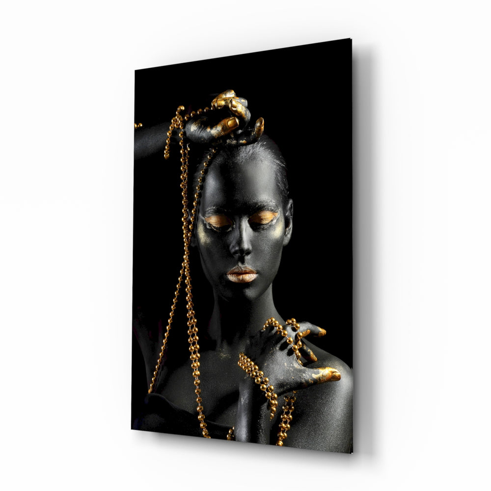 Gold Woman glass wall art displayed above a console in a designer interior