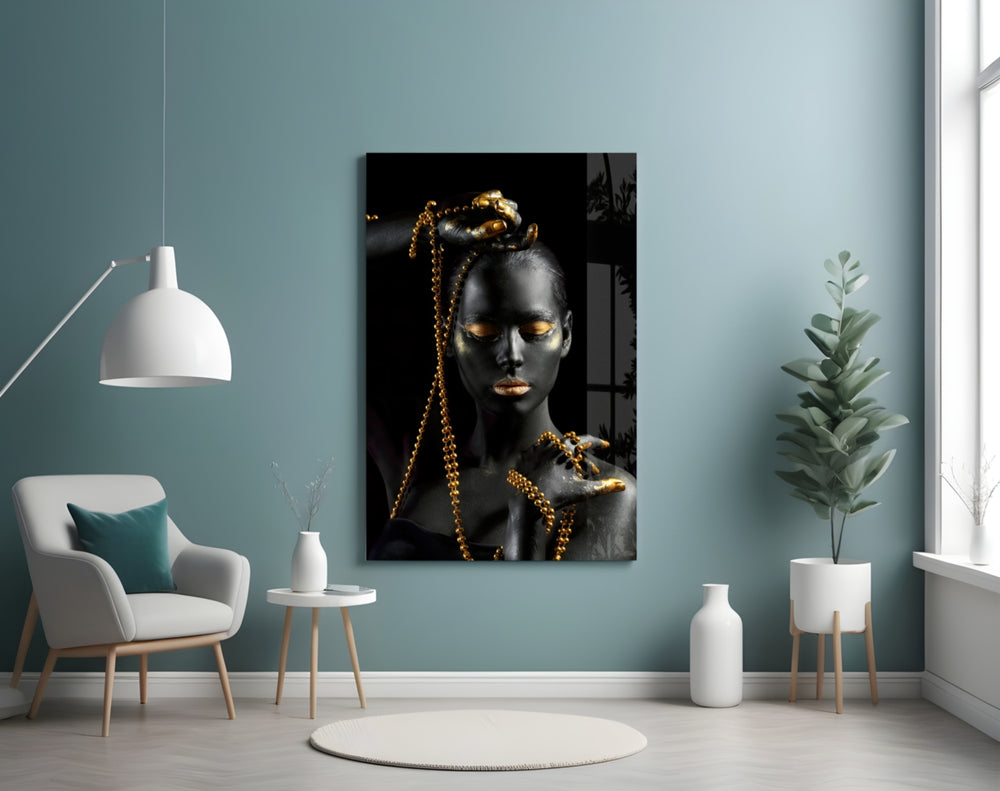 Gold Woman glass wall art styled above a vanity in a powder room
