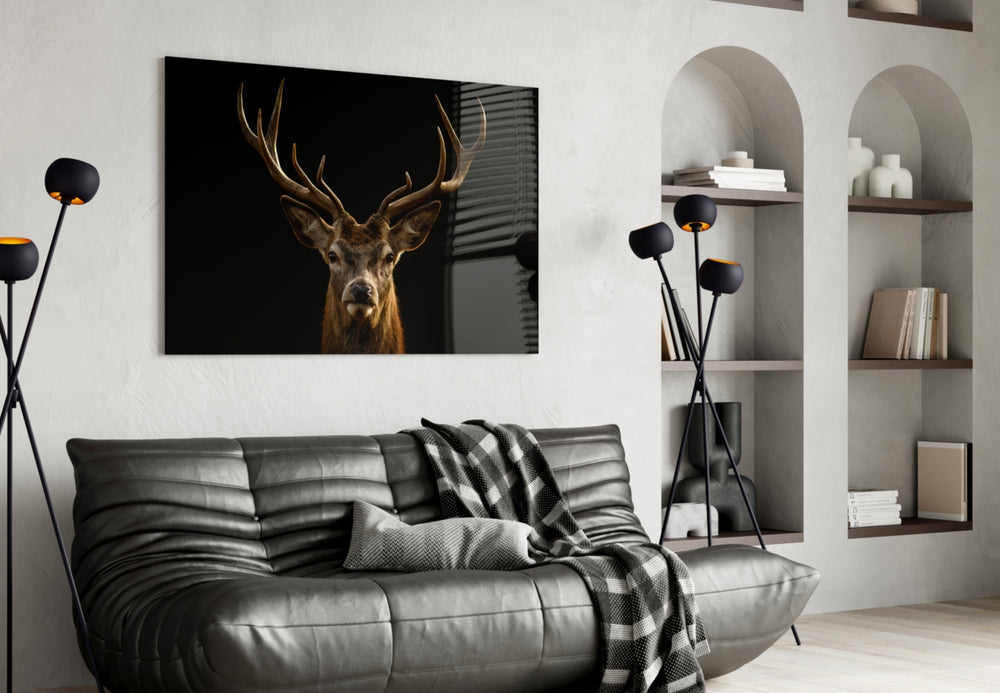 Deer glass wall art styled above a desk in an introspective study