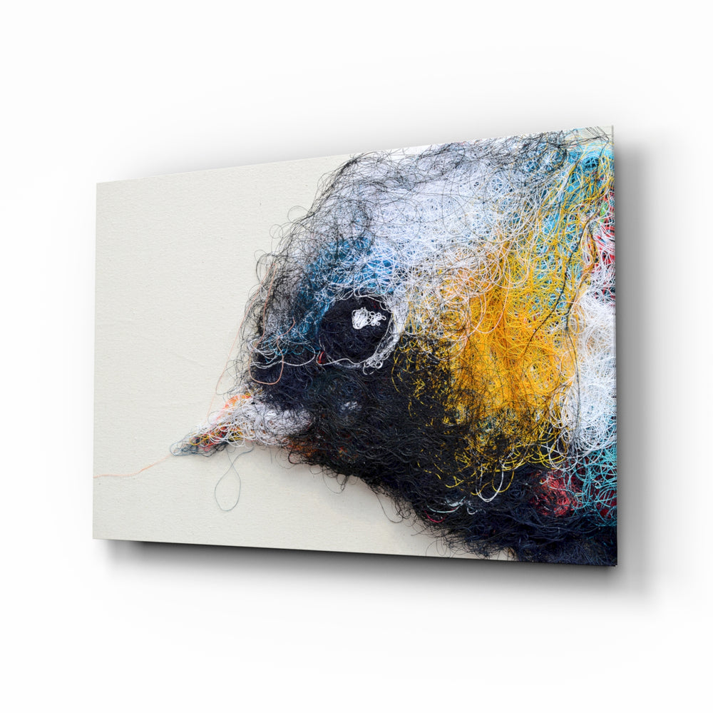 Tiny Bird glass wall art displayed above a console in a designer interior