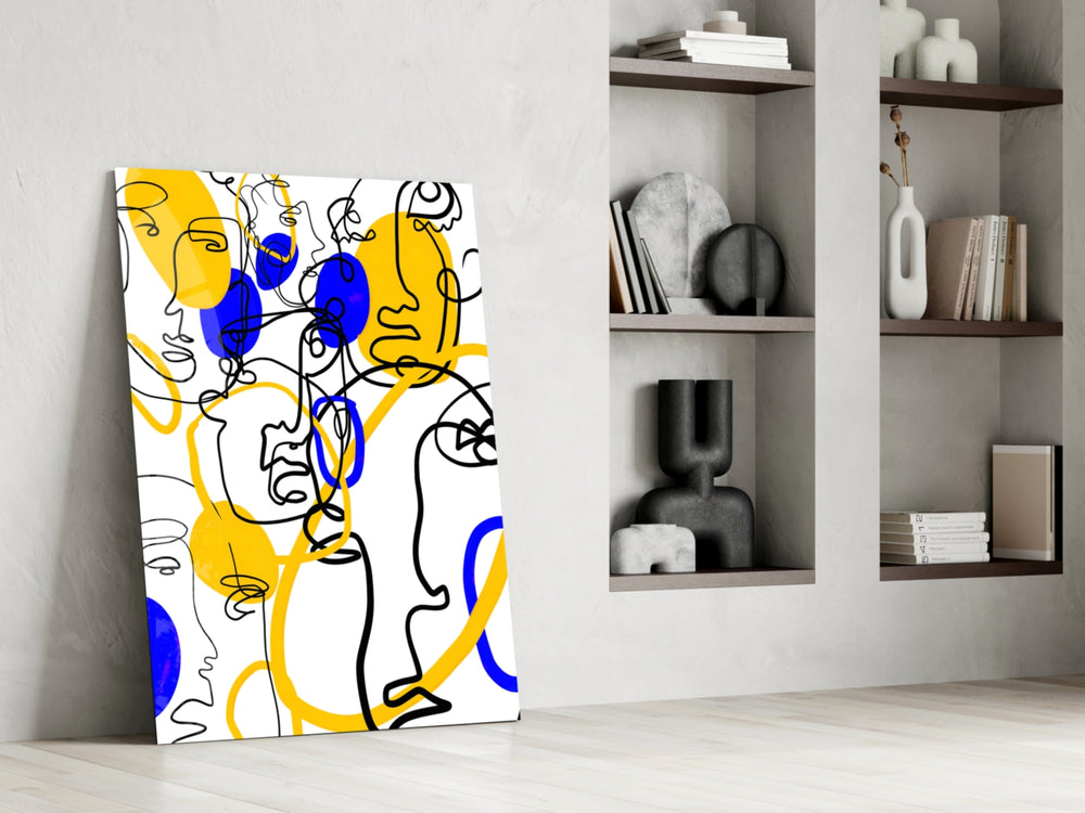 Abstract Faces glass print enhancing an art studio with editorial spirit