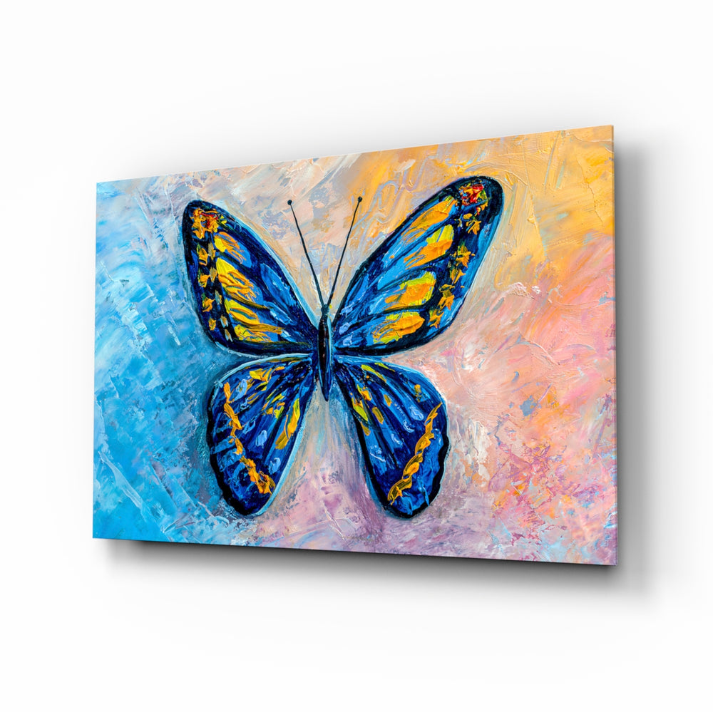 Butterfly glass wall art displayed above a console in a designer interior