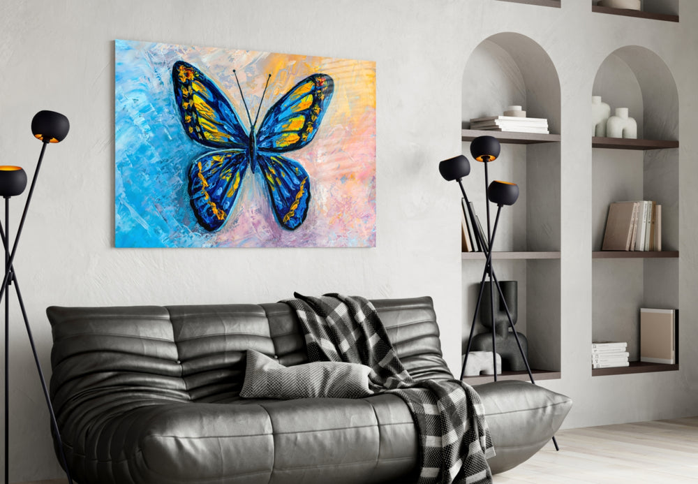 Butterfly glass wall art styled above a bed in a child's room