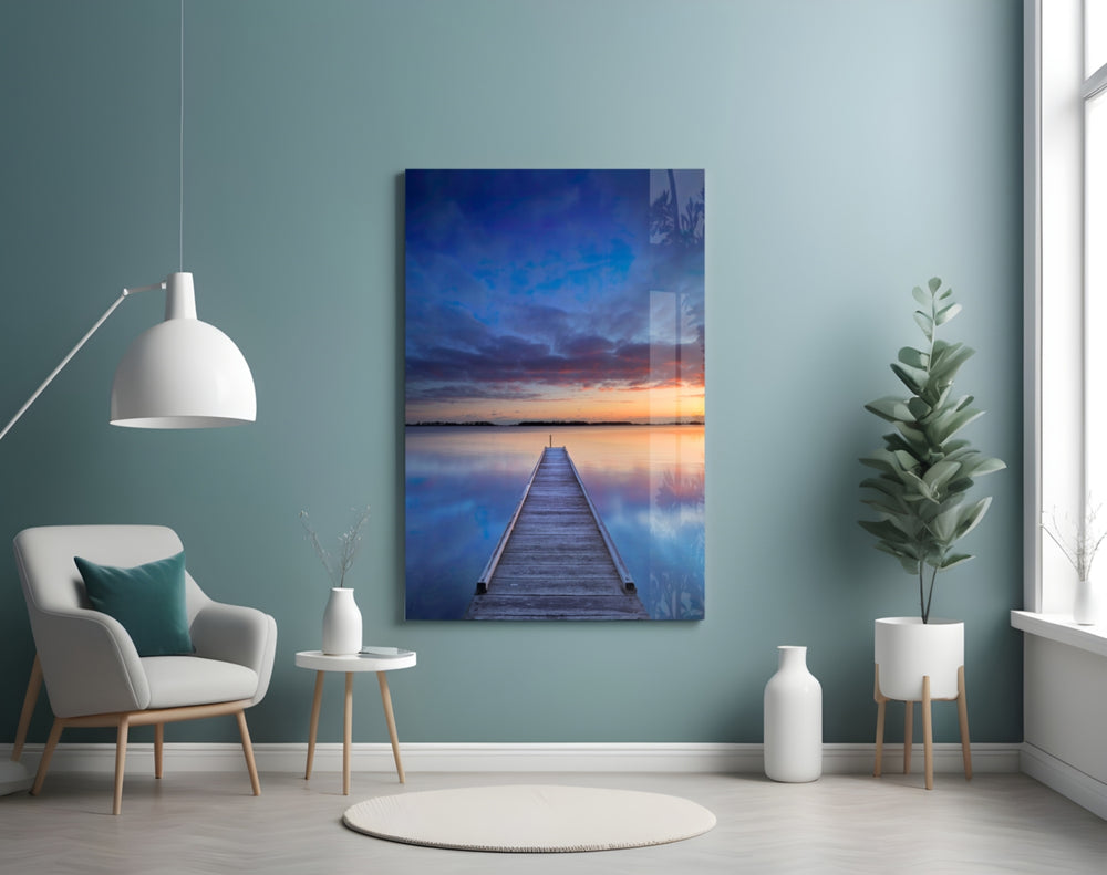 Quiet Pier glass wall art styled above a bed in a bedroom