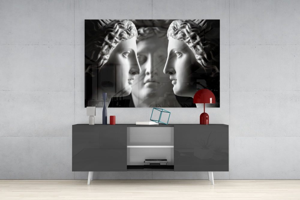 Three Muses panel catching gallery light to reveal its tactile carve