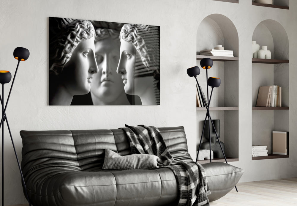 Three Muses glass wall art styled above a desk in a study