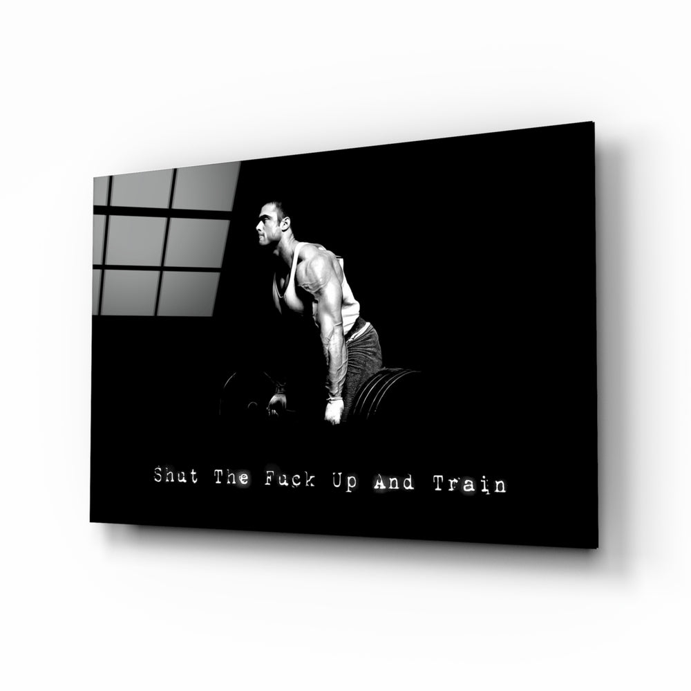 Gym-motivation panel anchoring a man cave wall