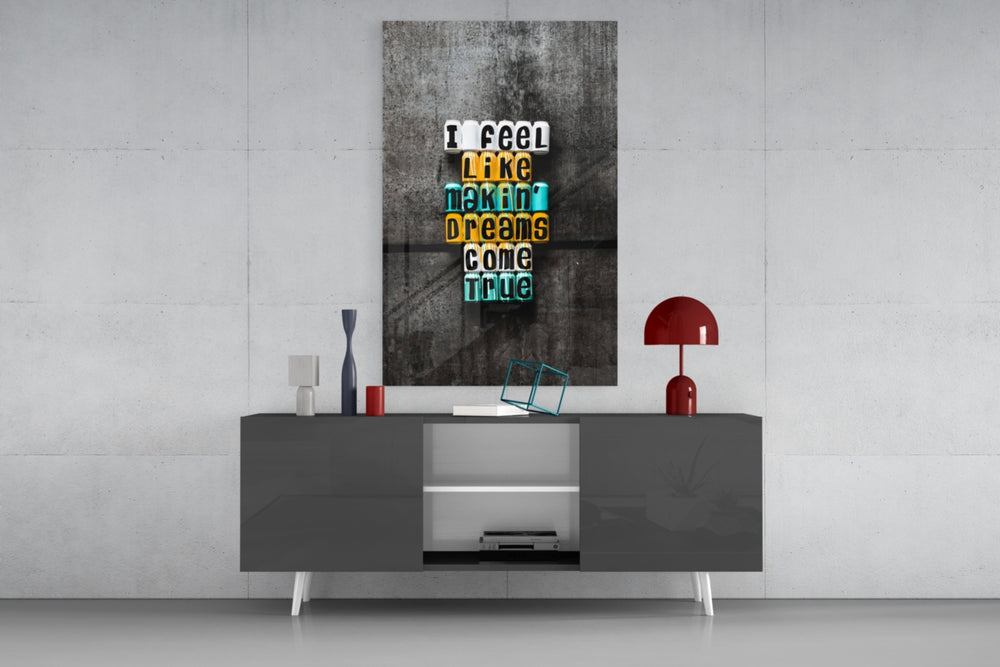 Dreams Come True glass wall art catching light to reveal its painted cans