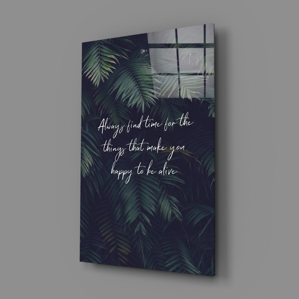 Close-up detail of palm fronds with handwritten quote behind glass