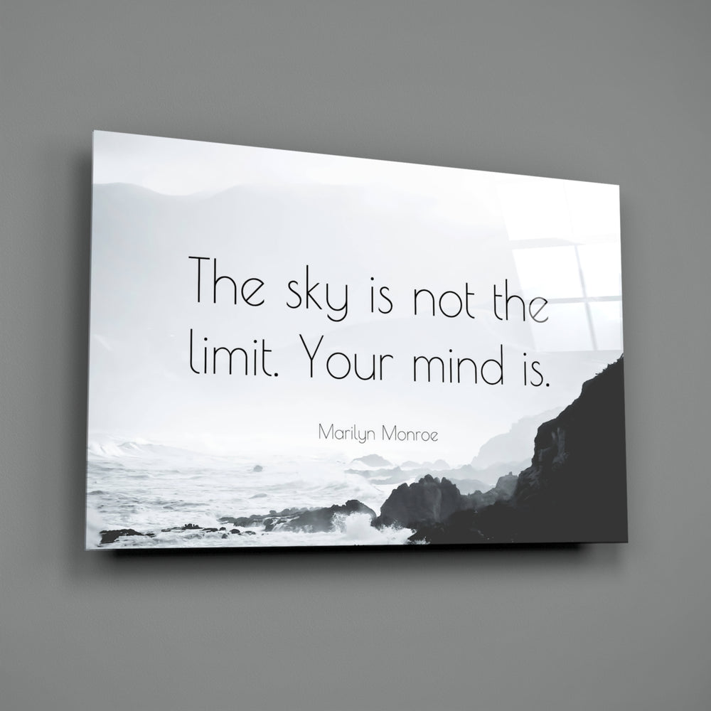 Close-up detail of misty coastline with quote behind glass